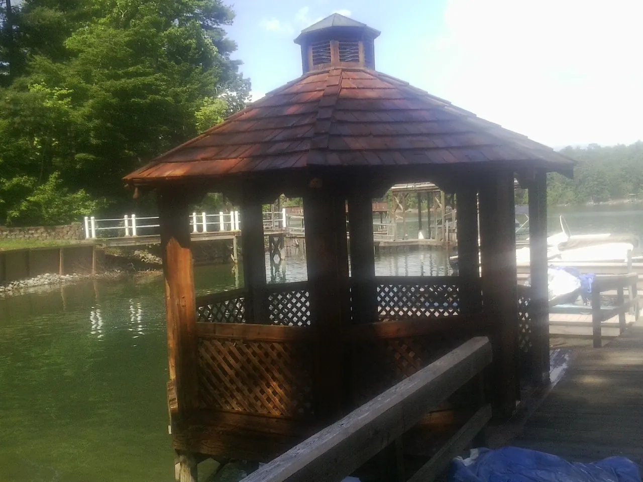 Cedar shake gazebo roof rebuilt on a lake dock in Jefferson City